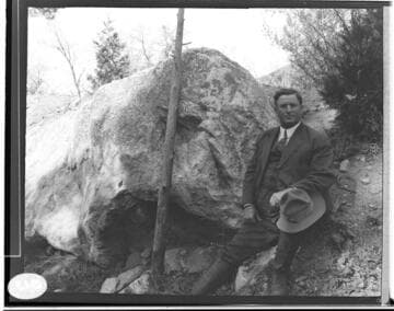 B.F. Pearson leaning up against the rocks