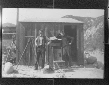 Two surveyors posing for a picture at Santa Ana River #1 Hydro Plant