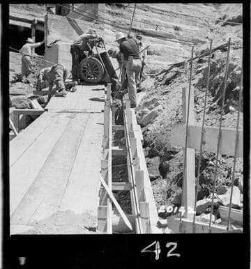 Pouring concrete in 12" bearing wall (east) forms above wye