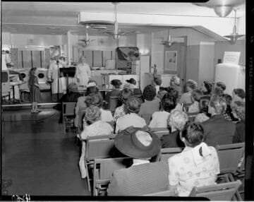 Electric cooking demonstration for an audience of mostly women