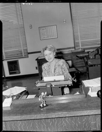 Lady typing in Edison office