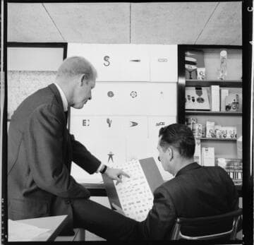 Edison art department designing new SCE logo, showing a variety of designs