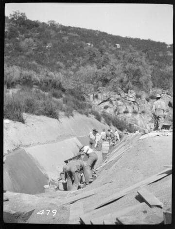 A construction crew plastering a ditch at Tule Plant