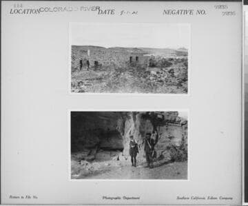 Colorado River - Men standing by rock building in desert