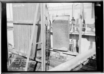 Cleaning screens in screen chamber at Redondo Steam Plant