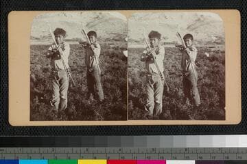 Hualapai Indian boys with bow and arrows