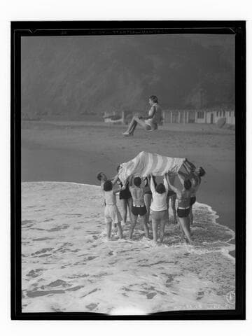 Betty Collier in beach blanket toss, Santa Monica