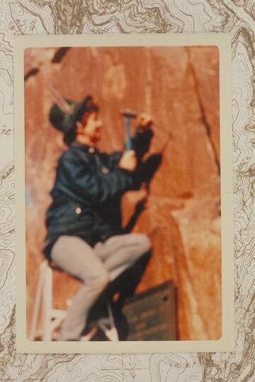 Frankie Strathairn drilling bolt holes for the replacing of the 1934 plaque at Separation Canyon