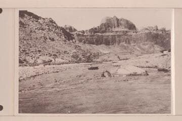 Bert Loper taking empty boat through No. 2 rapid at mouth of Piute Creek