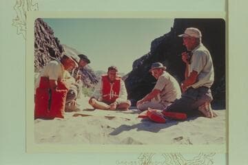 Up Separation Canyon from camp of 1965, June 26-27.  The Bureau of Reclamation men check the results of the cruise.  Bob Valentine is second from left.  Buzz Belknap is center and Bob Littleton is right