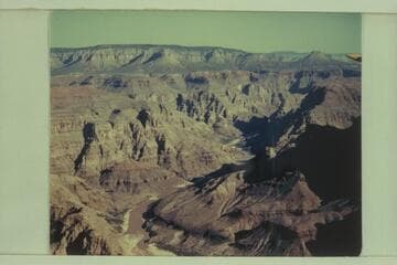 Upriver from approximately Mile 207.  The greenery on the right bank at right center is Spring Canyon