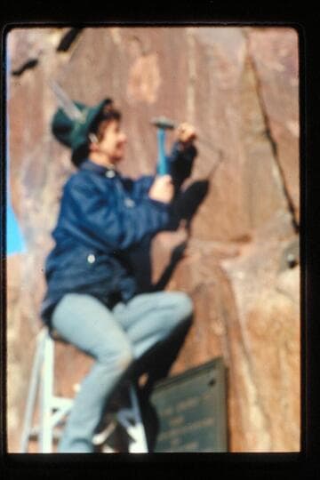 F. Strathairn drills bolt holes for plaque; Separation Canyon