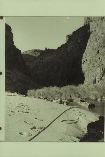 Dock Marston fishing from the upper end of the beach at Tapeats Creek.  The Chris-Craft is moored in the lagoon