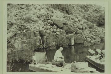 Lagoon at Tapeats Creek.  Joe Desloge works at packing the "Rattlesnake"; Archeyes Masland in the "Bootoo"