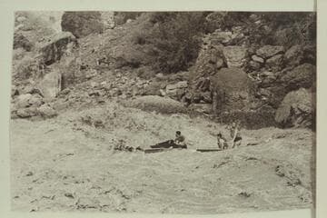 Jim-Bob Rowland at the wheel of the deck boat in Vulcan Rapid.  Dave Whiting and Wes Hildreth are passengers.  One motor drowned in the run