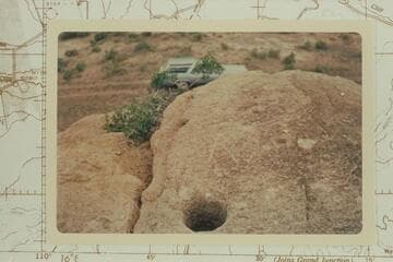 Holes in top of rock where Denis Julien cut his name and the date 1831.  Near Whiterocks in the Uintah Basin
