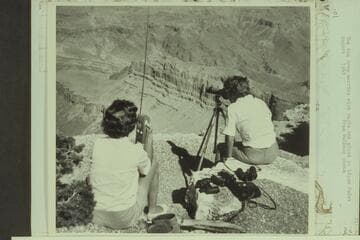 The Rim Crew worries with radio and glass at Lipan Point