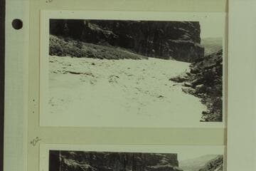 The "Esmeralda" making the first power run of Lava Falls.  One of the photographers who climbed down from Tuweep watches the run from the right bank