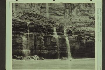 Waterfalls near Upset Rapid.  Norm Nevills, Agnes Albert and Bill Schukraft in the "WEN"