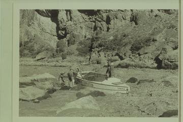 Lining Lava Falls.  P. T. Reilly; Norm Nevills; Jim Riggs, Jr