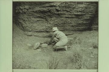 Nancy Haug (niece of Lois Sanderson) placing flowers on Willie's grave the day before Memorial Day
