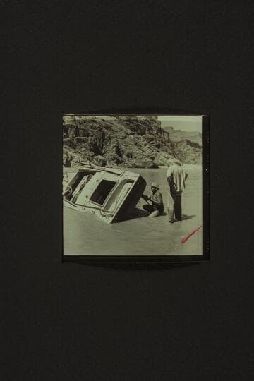 Bill Belknap drills holes for the patching of the CACTUS below Tuna Creek Rapid, Grand Canyon