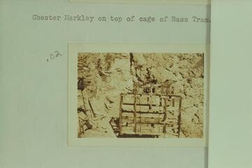 Chester Markley on top of cage of Bass Tram
