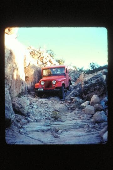 Red jeep coming down