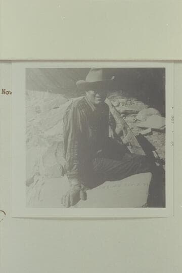 Reeves Baker sits over the "J. W. Black" name which is placed on a rock in a ruin to the left of the Aleson name.  It is situated on the left bank of the Escalante, high in the alcoves of the wall; about 1 1/4 mile below 25 Mile Wash