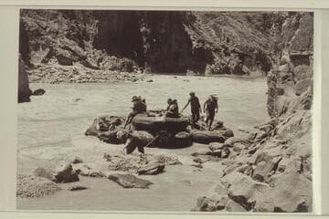 The "Queen Mary" of Georgie White's fleet in trouble on the left side of Bedrock Rapid
