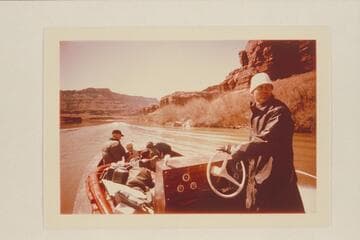 Tex checks where he has been during the run from Moab to The Junction with his jet boat "Major Powell" loaded with a party plus four Sportyaks