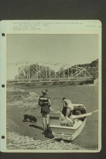 Stowing dunnage in punt at highway bridge below Dolores on the Dolores River.  Becky and Pres Walker