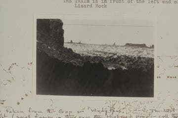 Southeast from trail at east side of The Gap.  Lizard Rock near the right.  The Wall is right margin.  The Plug is left of Lizard Rock.  Standing Rock is left of The Plug.  The train is in front of the left end of Lizard Rock