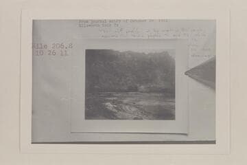 The skiff of Charles Smith at lower right.  The two Kolb boats lower center in Cataract Canyon at Mile 206.8 left bank