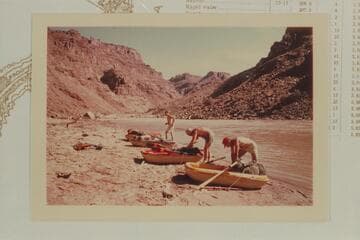 Packing the Sportyaks at camp at Mile 209.6.  Rapid #6 is upstream