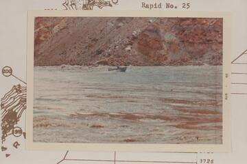Harris-Brennan boat out of the lower end of Rapid 22.  The Sliced Boulder appears back of boat
