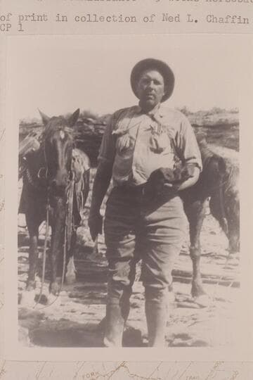 Harald W. C. Prommel on De Chelly Sandstone--oil saturated--near mouth of South Hatchie Canon.  Nequoia Arch Reconnaissance; 3 weeks horseback