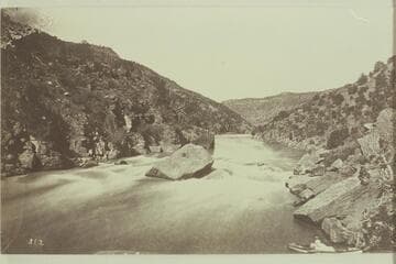Ashley Fall, Red Canyon, Green River.  Ashley's name was found on right of picture on one of the huge fallen rocks, about at the top of the old dead tree.Marked on back "481, Hillers."  More likely it was made by Beaman