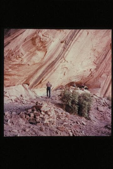 Photographing ruins in large cave in upper Surprise Valley