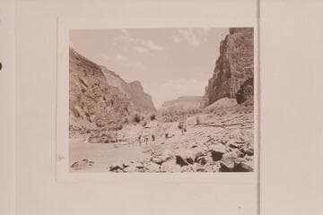 On the beach below Lava Falls after portage.  Nevills party of 1947.  One of the springs flows off the point at the left.  Bright Angel gauge:  18,300 cfs