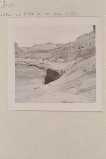 Small drop of about 5 ft. in bottom of southwest fork of 7s.  Below the point of trail entry.  599 GNCN 73.51.3 is from below this drop