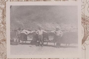 Cots at Lees Ferry brought in by Parkyn, Lovett, and Daniels.  Tom Lovett is center between Navajos.  Copy of print #15 in Waller collection