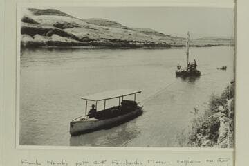 Launch towing construciton scow up to dredge