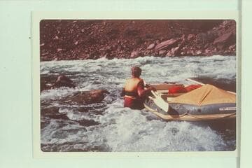 Nosing the small inflated craft at Hance Rapid; Ed Herrman, Howard Booth and Jorgen Visbak