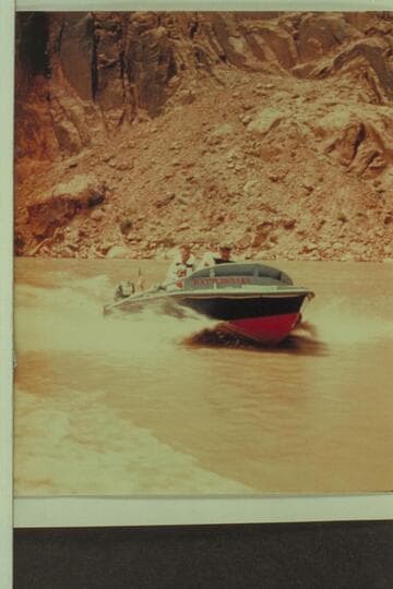 The shakedown cruise up into Glen Canyon.  Butchart sits on the deck aft.  Lodell Mathews is down in the cockpit.  Preston Mercer is almost hidden by Rod Sanderson who is at the controls
