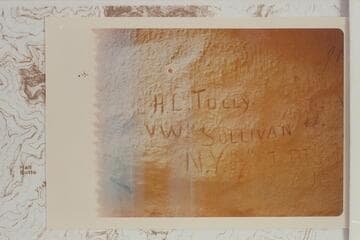 Inscriptions at the west side of Hance Canyon at the highest showing of the Tapeats Formation