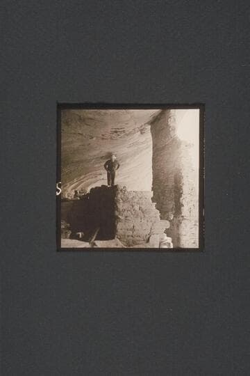 Bill Belknap looks for a picture in the ruin in Marsh Pass