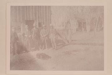 The old saloon at Thompson:  H. G. Ballard at center and Doc King on right.  The scene of many a fight