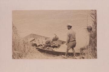 A fold-flat boat in use by the Rainbow Bridge-Monument Valley Expeditions on the San Juan and lower Glen Canyon; 1933-1938
