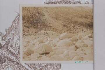 Downriver at Dubendorff Rapid. The rocks in foreground trapped the Eddy boat "Powell" 1927, July 27, when the river state was about 20,000 cfs